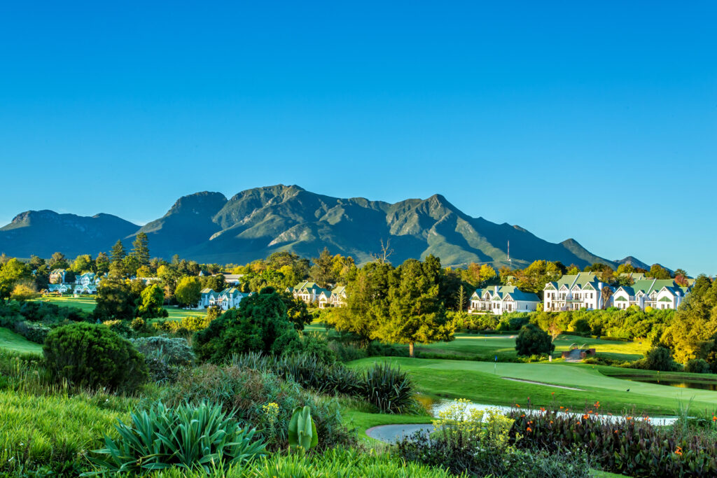 golf hole with mountain backdrop