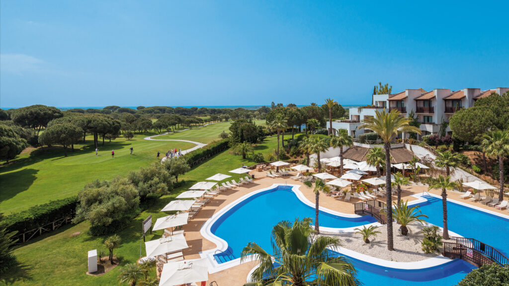 Hotel pool with golf course in the background