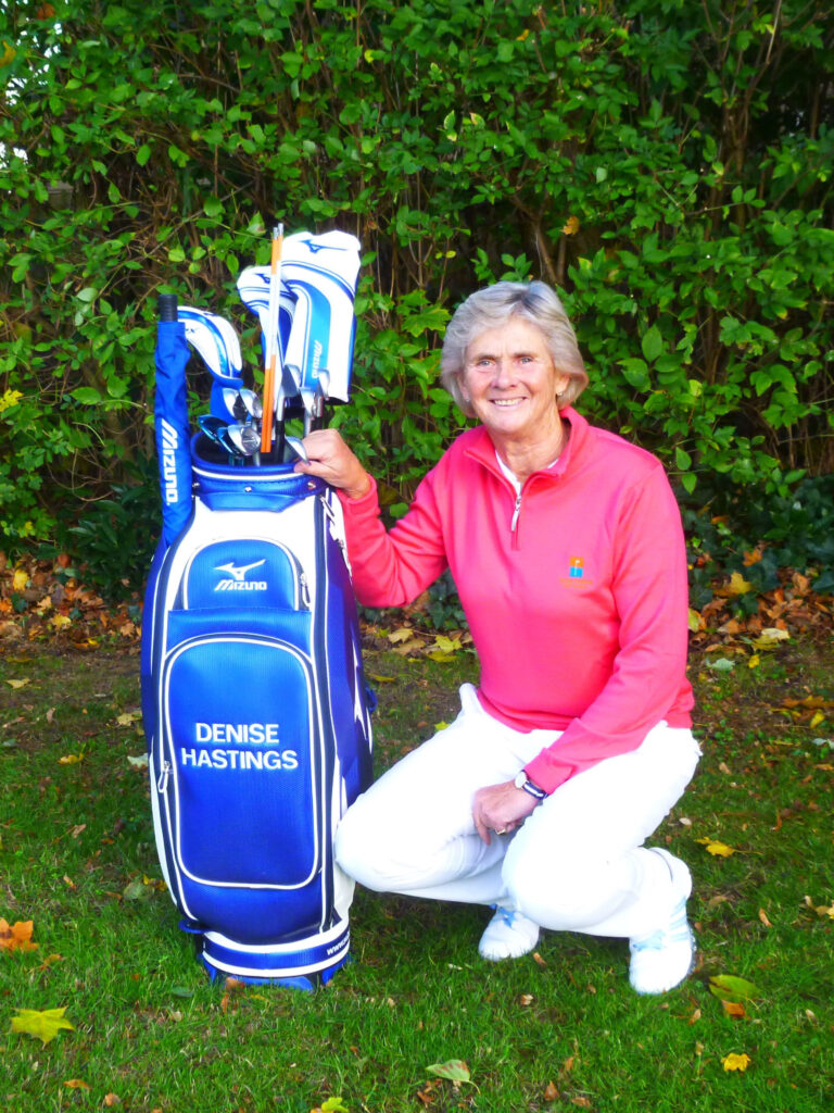 denise kneeling with bag