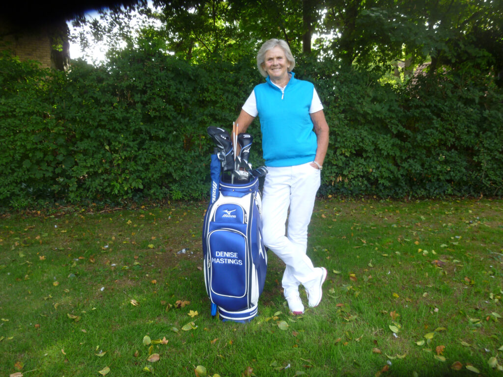 denise standing with bag